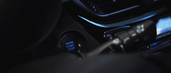 Obraz na płótnie Canvas engine start stop button in the car interior