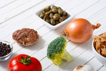 mediterranean food ingredients on white wooden