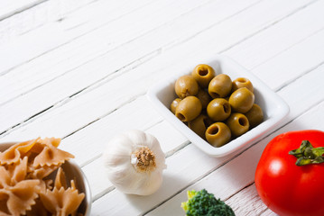 mediterranean food ingredients on white wooden