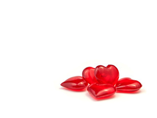Many red hearts stacked in a heap on a white background. Valentine's Day. love symbol. Copy space