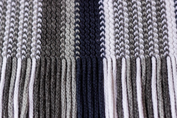 Small and dense knitted texture knitting threads of blue shades. Fine knitting texture.