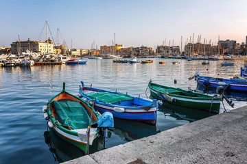 Beautiful view of the port with yachts and old color boats.