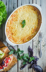 Baked zucchini and cheese soufle with italian bruschetta and herbs