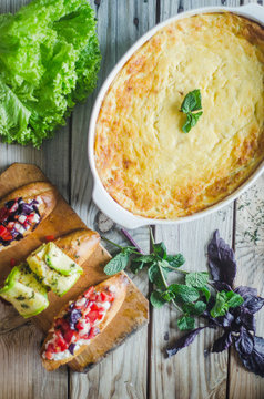 Baked zucchini and cheese soufle with italian bruschetta and herbs