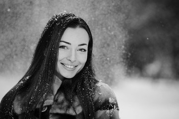 Beautiful pretty young woman in winter forest.Portrait picture.