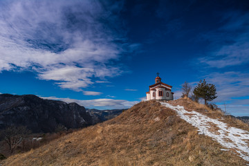 Fototapeta na wymiar Chapel in the winter mountain