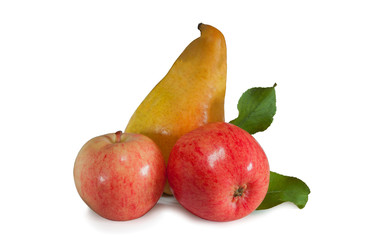 Ripe, yellow pear with two apples and green leaves isolated on white