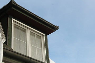 Fototapeta na wymiar Roof window and bluew sky.