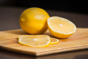 Sliced lemon thin rings on the board