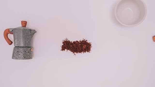 Stop motion footage of preparing coffee process. Animated process of grind coffee beans and cooking in mocha pot.