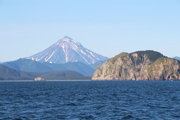 View of Vilyuchinsky volcano (also called Vilyuchik) from tourist boat. It's a stratovolcano in the southern part of Kamchatka Peninsula, Russia.