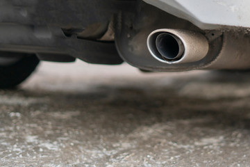 Fototapeta na wymiar close up exaust pipe of a car releasing gas b