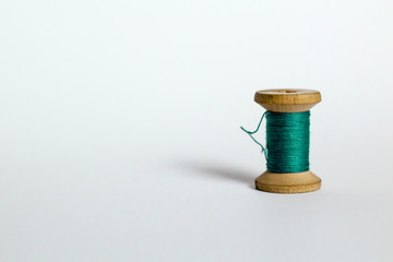 green virid vintage thread on white background
