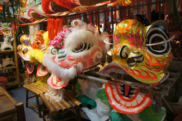 Chinese tradition lion mask or lion head displayed on rack. It is used to performed lion dance during Chinese New Year Festival.   