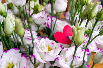 Lisianthus flowers bouquet with red heart