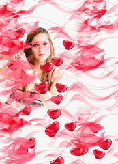 Obraz na płótnie Canvas girl with hearts on a pink background
