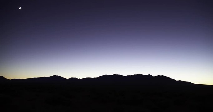 A time lapse of a sunset, stars in the night sky and a sunrise over the Henry Mountains, near Hanksville, Utah.