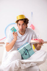 Young man celebrating his birthday in hospital