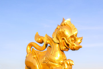 Golden Thai lion statue in Singha Park, Chiang Rai, Thailand - 247025256