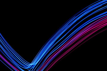Long exposure, light painting photography.  Vibrant electric blue and neon pink streaks of colour...