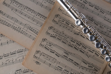 Flute on old notes background for graphic and web design, Modern background. Internet concept. Trendy background for website design or mobile app