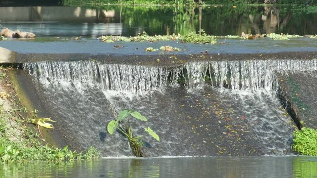 the front view of the check dam block between the stream and reservoir