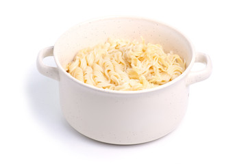 Noodles in a plate on a white background. Isolation