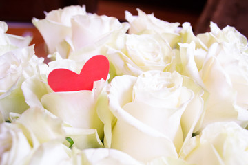 Roses flower bouquet with red heart