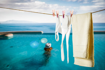 Bathing suit on a string by the pool in an exotic resort   