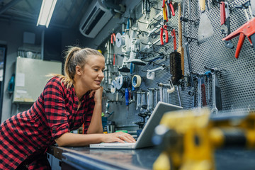 Female mechanic with laptop
