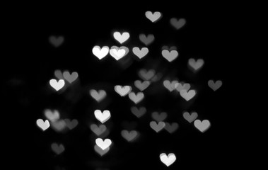 Silver background with bokeh hearts