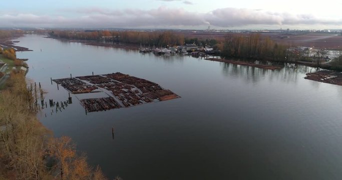 Log Boom Tug at River in Vancouver, Canada. Drone flying. Aerial 4k view.