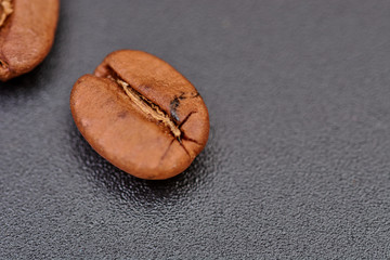 coffee beans on black background consistent with