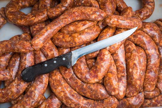 Freshly made delicious traditional pork sausages ready for baking