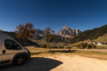 RV park in autumn on a pass road with blue sky
