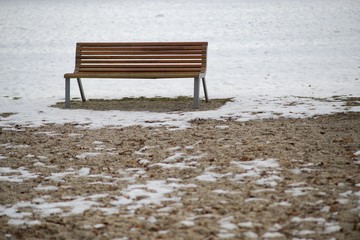 Bench in park, resting in nature background.