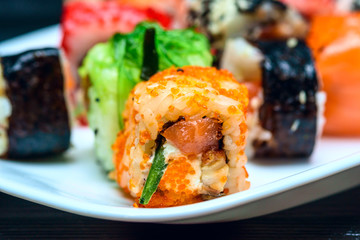 Sushi on a white plate photographed close up.