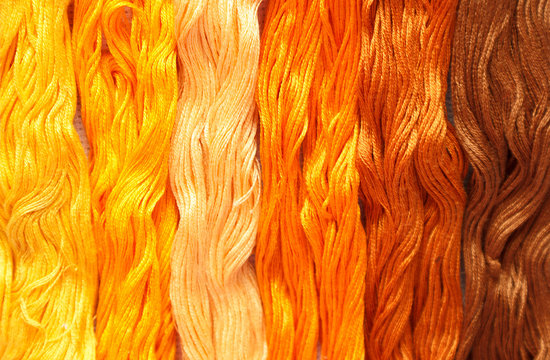 Threads Of Yellow Shades Are Listed In A Row.