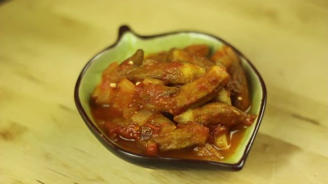 Bamiah, okra, bamia in tomato sauce, onion and olive oil.  Tasty and delicious Mediterranean food