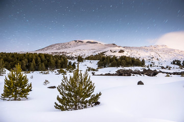 Beautiful night landscape in Sicily, Volcano Etna and snow during an eruption