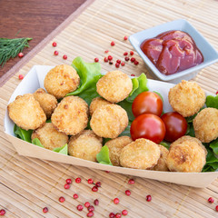 Chicken meatballs with lettuce, tomato and sauce