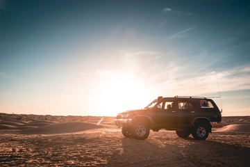 Fototapeta na wymiar Adventure trip in the Sahara desert, excursion with 4x4 vehicle