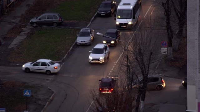 cars go on the road at dusk
