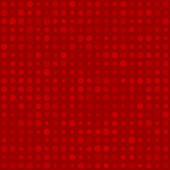 Abstract seamless pattern of small circles or pixels in various sizes in red colors
