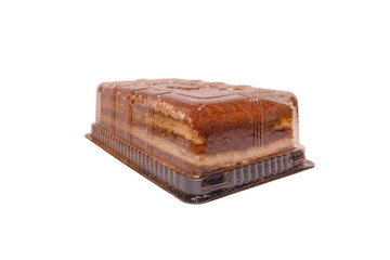 Chocolate dessert in plastic packaging on the side on white isolated background
