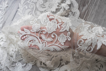 The texture of lace on wooden background