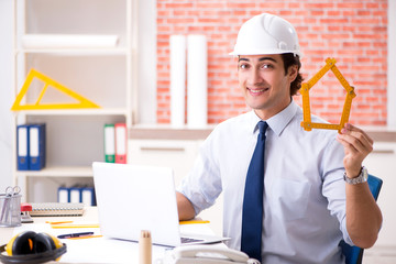 Construction supervisor working on blueprints