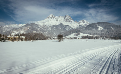 Cross-country skiing in Austria: Slope, fresh white powder snow and mountains