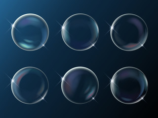 Set of realistic bright sparkling soap bubbles with rainbow reflection on dark night bakground, vector illustration.