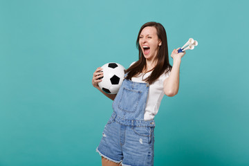 Screaming young woman football fan cheer up support favorite team with soccer ball, pipe isolated...